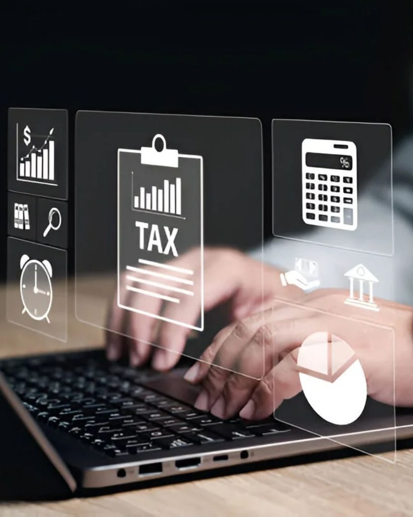 Capital gains tax on sale of business: tax clipboard, calculator and charts over a laptop